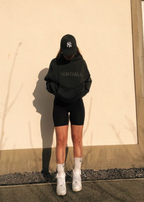 Black hoodie and navy bike shorts